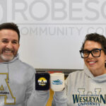 RCC establishes new partnerships with Appalachian State, Wesleyan University. Joey Hinson & Ursula Lowry cheers coffee mugs