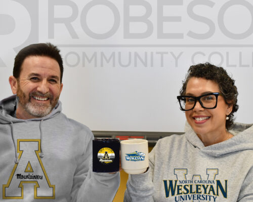 RCC establishes new partnerships with Appalachian State, Wesleyan University. Joey Hinson & Ursula Lowry cheers coffee mugs