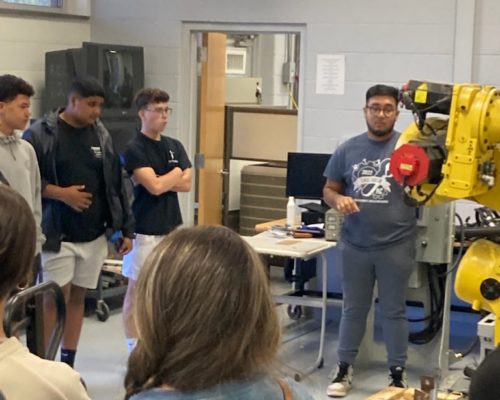 Mechatronics - Jonathan Gabino talks with high school students about the program