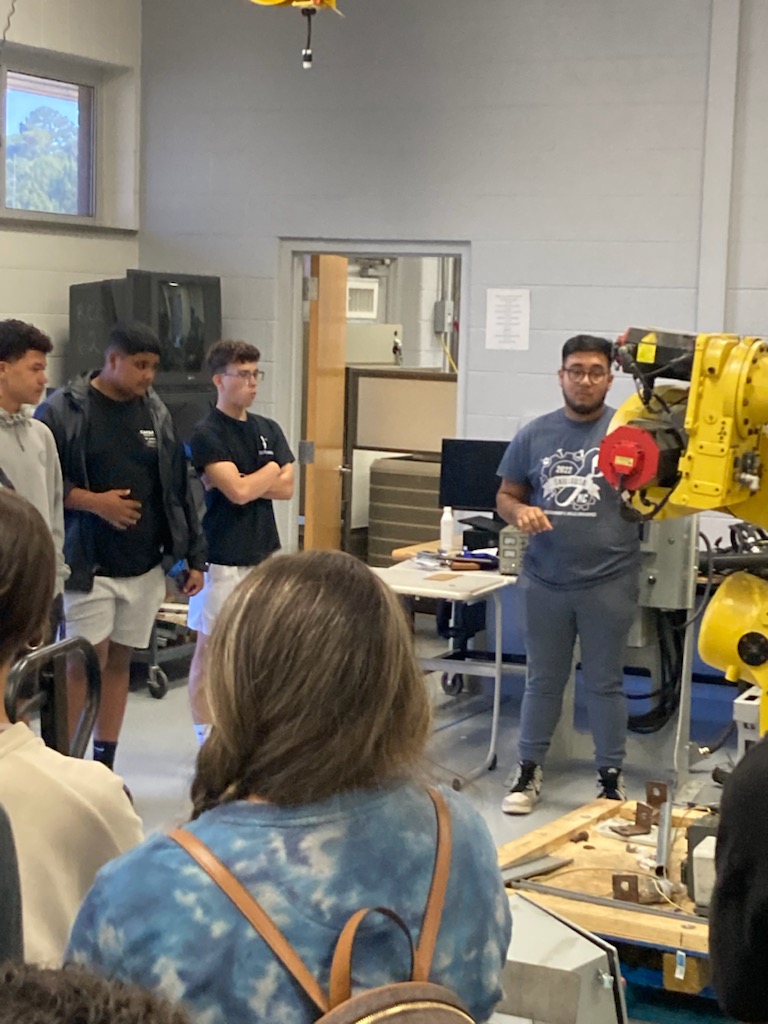 Mechatronics - Jonathan Gabino talks with high school students about the program