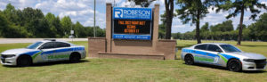 BLET cars in front of RCC sign