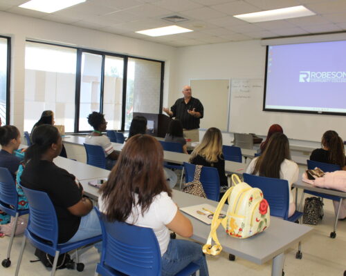 students in class listening to the instructor