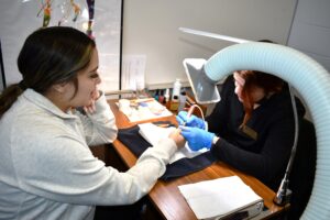 Fall festival at Comtech. Manicurist.