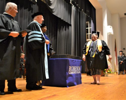 Graduate receiving Diploma