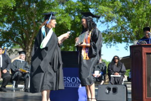Krystal Clark receives degree from President at Graduation 2022 ceremony