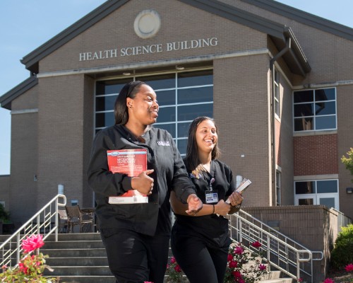 Two Female Students Walking to Class