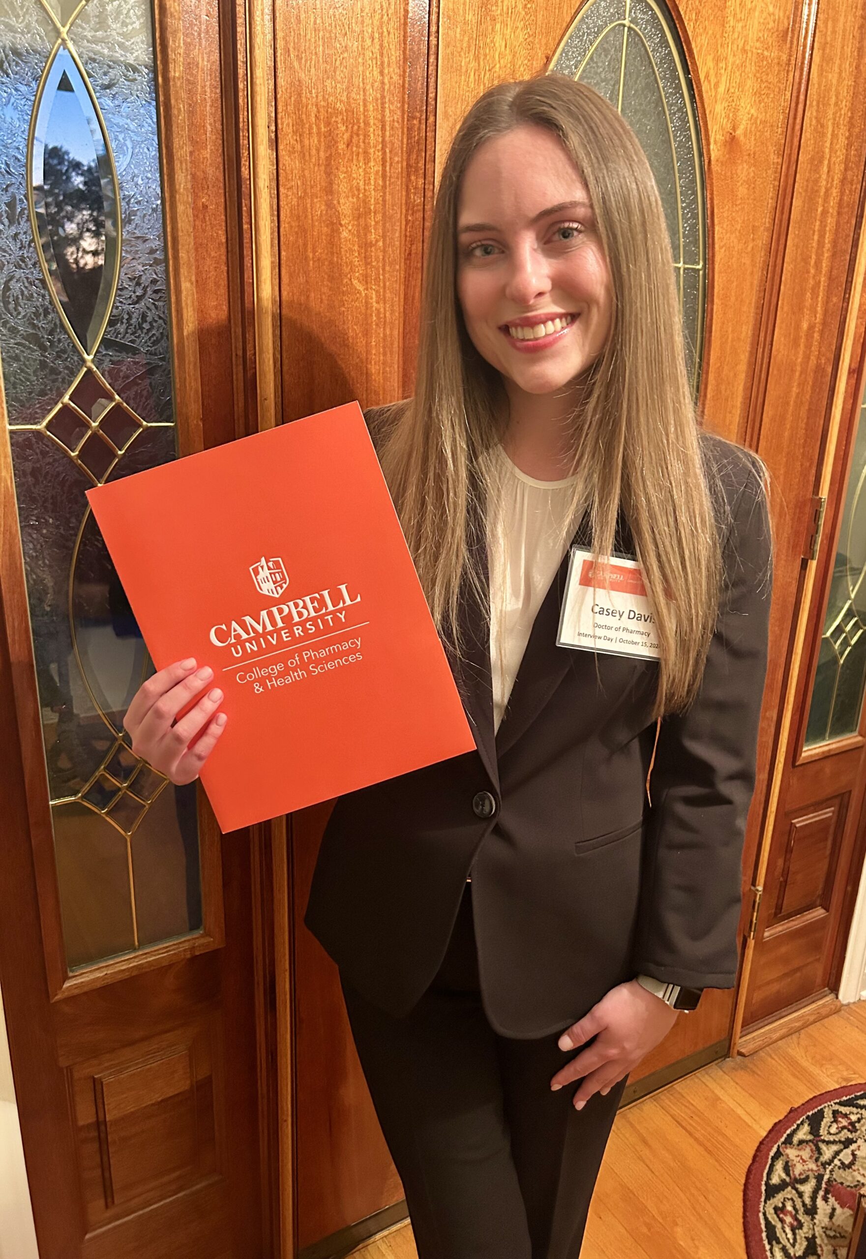 Casey Davis holds folder reading Campbell University. RCC’s short-term training helps Casey Davis land a $20,000 Scholarship