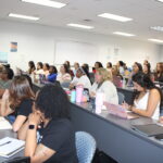 Nursing students listen attentively in class