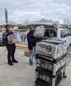 students helping other people collecting supplies