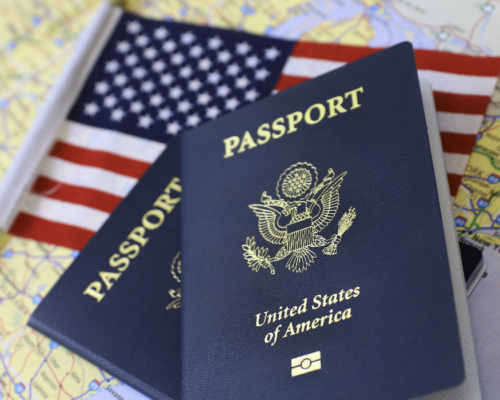 Passport with American Flag in background