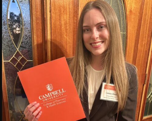 Casey Davis holds folder reading Campbell University. RCC’s short-term training helps Casey Davis land a $20,000 Scholarship