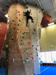 student climbing