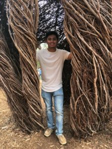 Student inside sculpture at UNC Chapel Hill