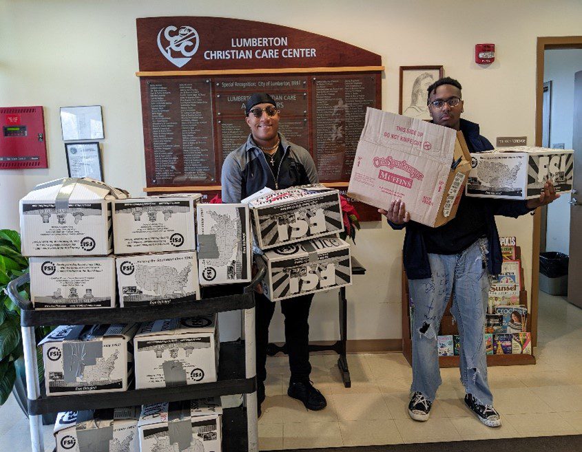 students helping collect supplies